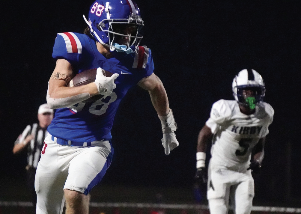 EYES ON THE PRIZE: A determined John Painter ’27 hustles upfield, leaving a Kirby defender in the dust.