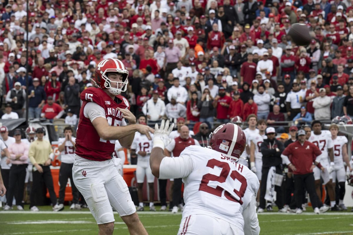 Fernando Mendoza, Indiana University quarterback, number 15, throws the football during the 2026 Rose Bowl at Pasadena, California, Jan. 1, 2026. Photo Courtesy of Tech. Sgt. Anthony Hetlage, Public domain, via Wikimedia Commons.