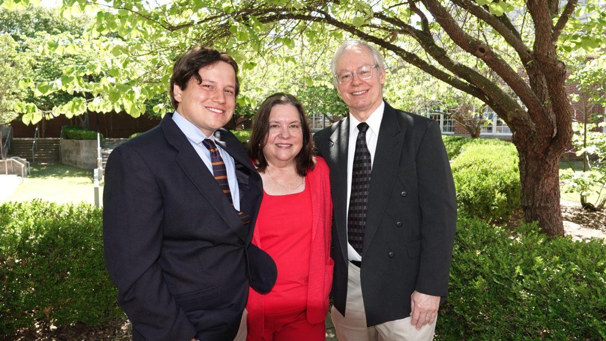 Mrs. Hopper poses with her family in front of the amphitheatre