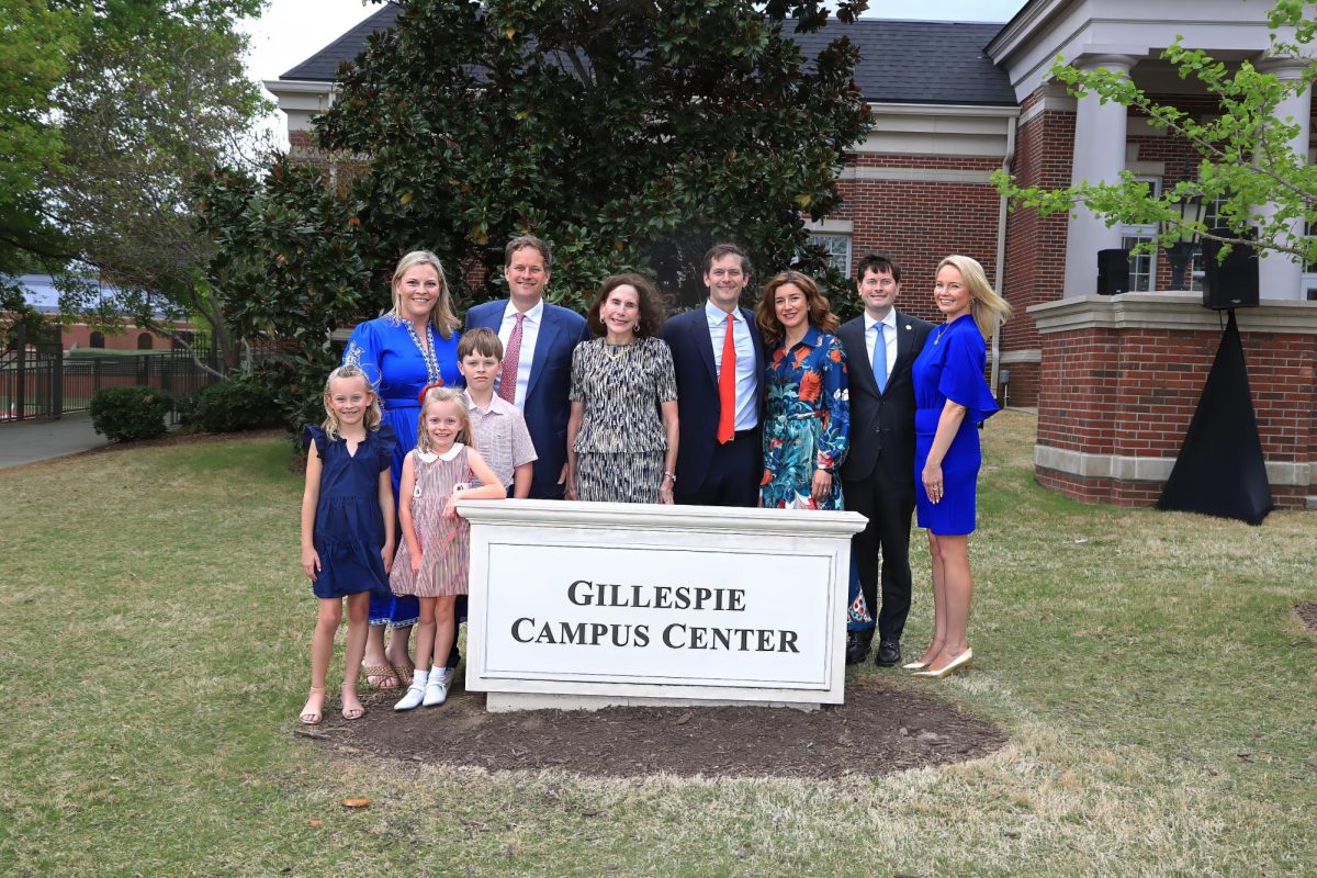 Members of the Gillespie family stand around the new monument sign.